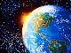 sun bursting behind the earth