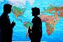 stock photography business people discussing infront of world map